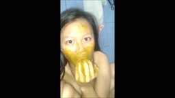 Asian girl smear shit on face