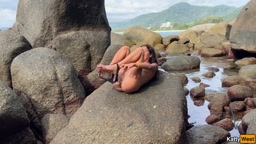 bates with oil on beach