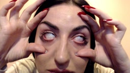 Eyes held open and rolled back