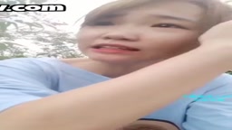 Cute Chinese girl strips and fucks outside