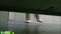 Korean woman anxiously pees