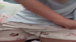 A cute chi college girl with shorts pees in toilet