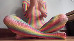 Teen in Rainbow Fishnets Fingers Herself