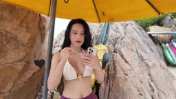Sexy girl takes pants off at the beach