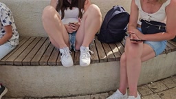 Fresh Daughter in Denim Shorts Sitting on a Bench