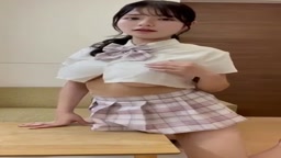 Busty girl masturbates on the corner of the table