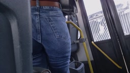 Brunette With A Big butt In Jeans At The Bus Door