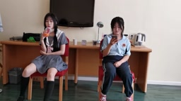 Two Chinese girl holding competition,one wear jk,other one wear shcool uniform.