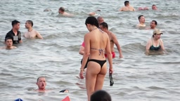 Filming bikini girls at the beach