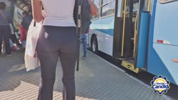 Hot Brunette At The Bus Stop