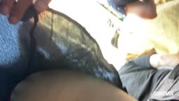 Skirt lifting, with boyfriend next to her
