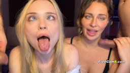 Two Slutty Babes Sucking Cock Side by Side