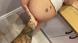 A girl gets fucked in the kitchen