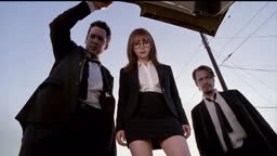 Woman In The Black Suit