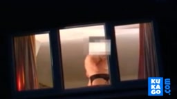 Voyeur watching neighbour at window.