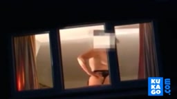 Voyeur watching neighbour at window.