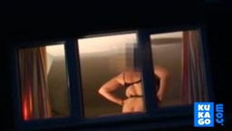 Voyeur watching neighbour at window.